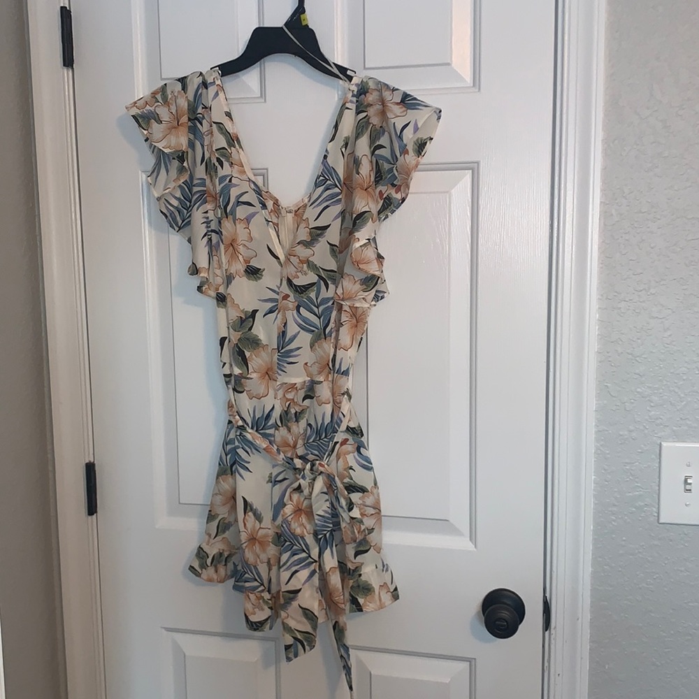 Women’s Medium Floral Spring Romper with adjustable Bow.